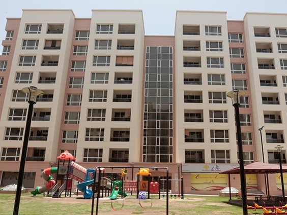 Modern apartment building with playground in Muscat, Oman